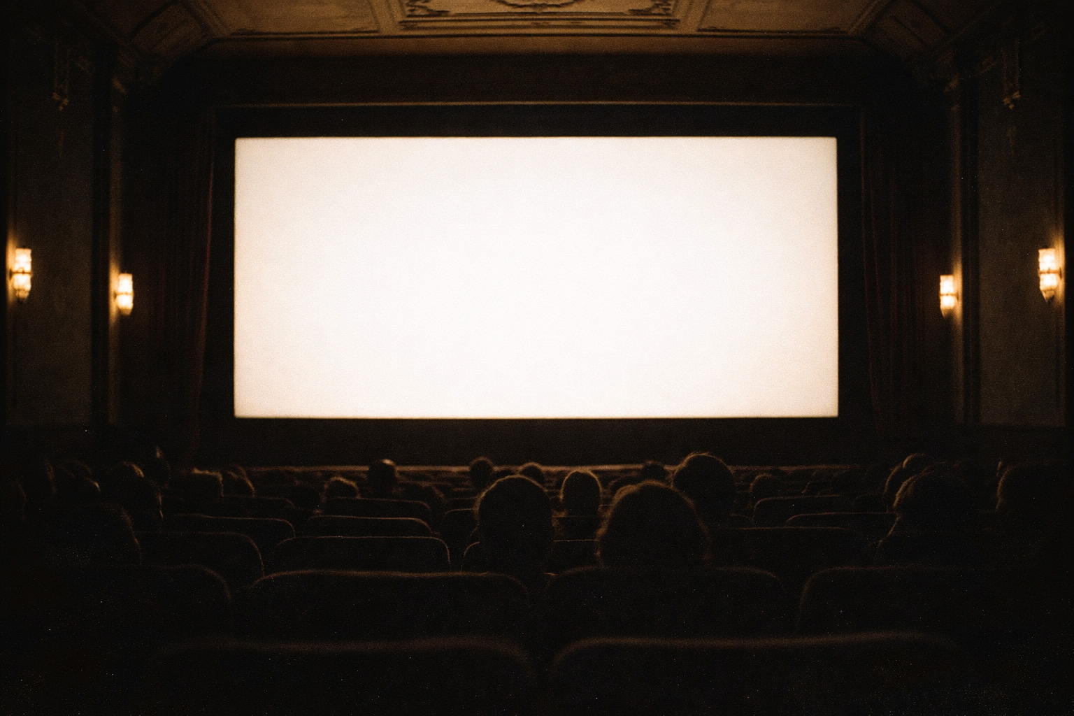 Movie theater interior with bright empty screen